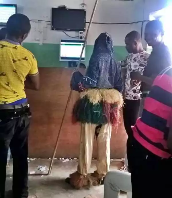 Recession in the Spirit World? Local Masquerade Spotted at Bet9ja Shop for Sports Betting (Photo)